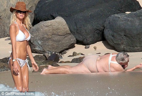 Playboy playmate in white bikini