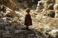 Kid among garbage wallpaper